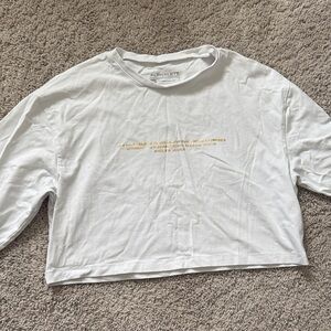 Alphalete White Long Sleeve Crop Top with Gold Graphic